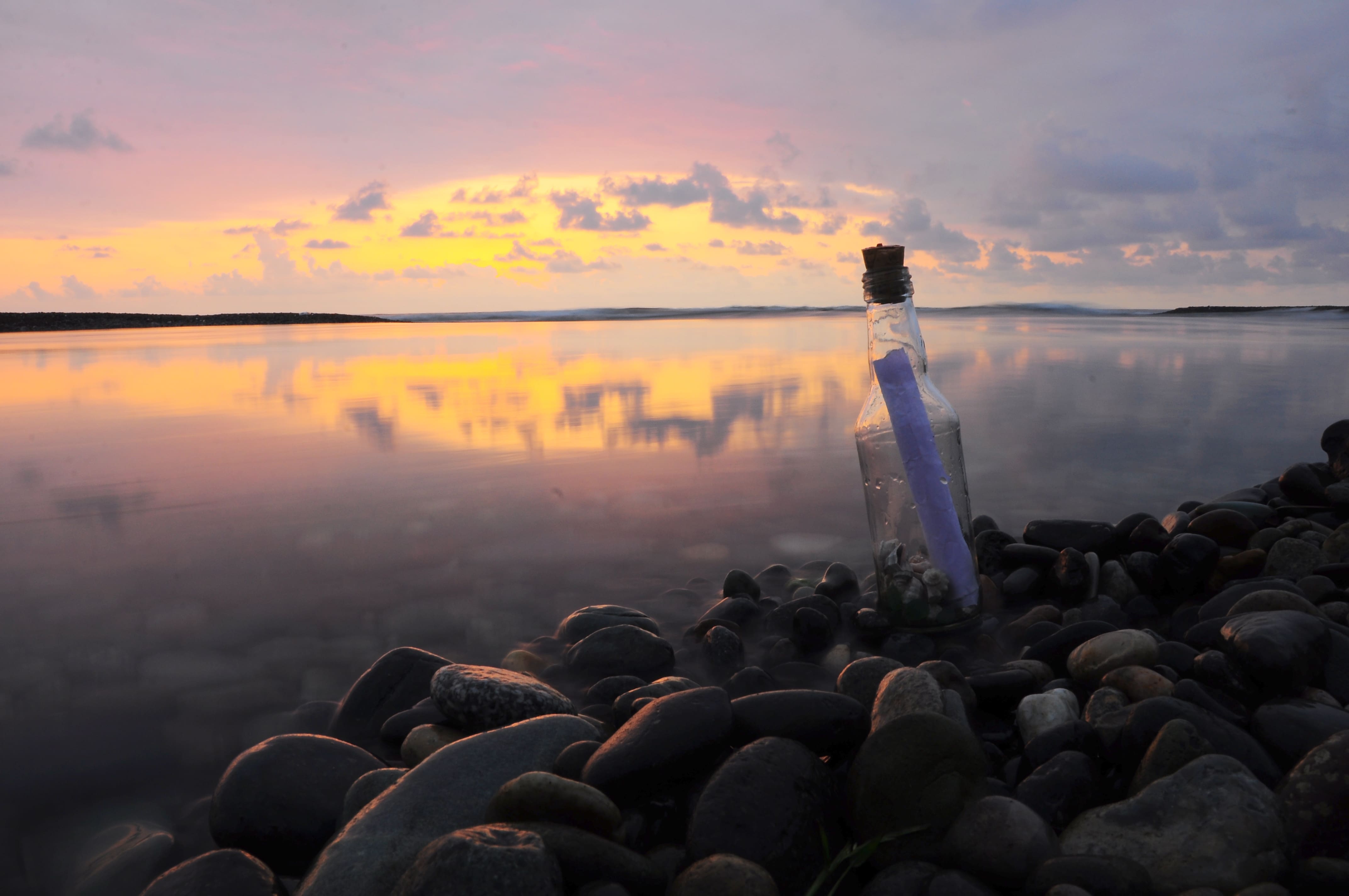 Rocky beach with a message in a bottle