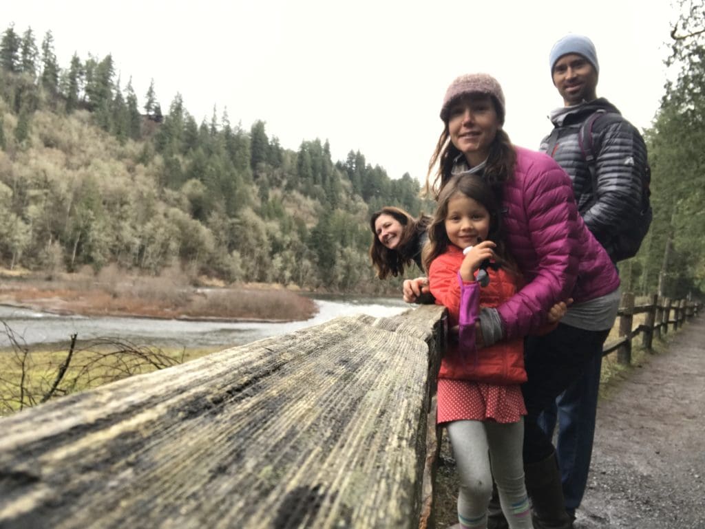 Nicole Lampe talking water with family during a hike alongside Oregon's Sandy River.