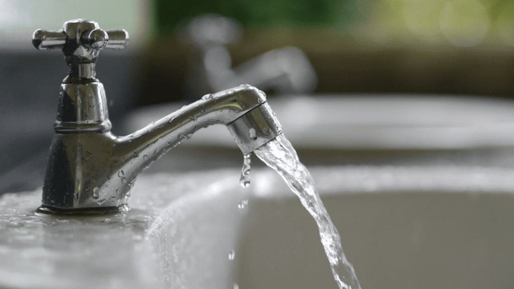 Residential tap water running in a sink