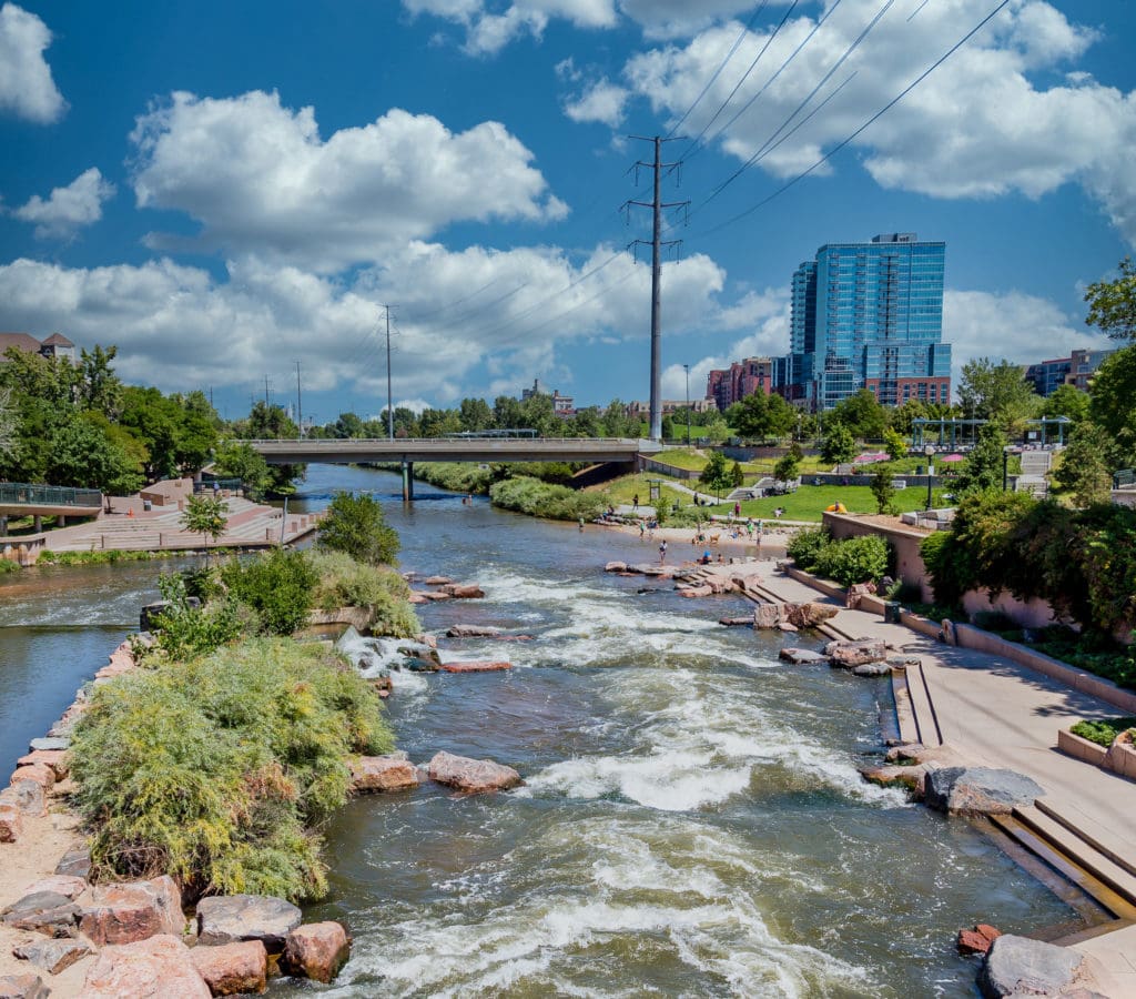 Photo of people playing in the Platte River in Denver, Colorado.