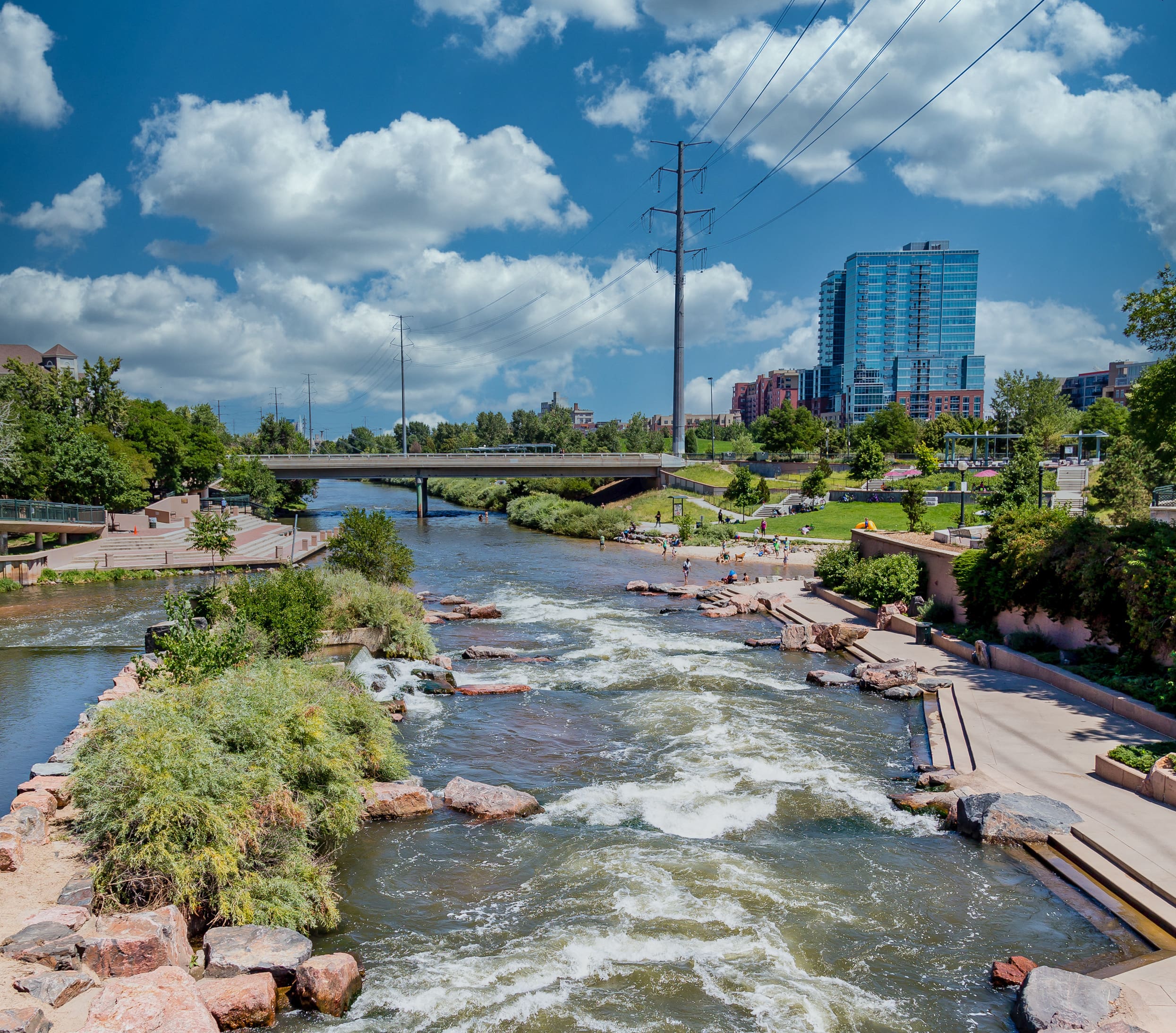 Photo of people playing in the Platte River in Denver, Colorado.